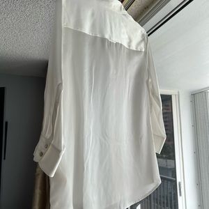 This is a L’Agence blouse in size medium